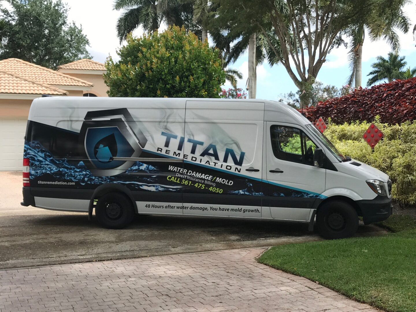 A white van parked on the side of a road.