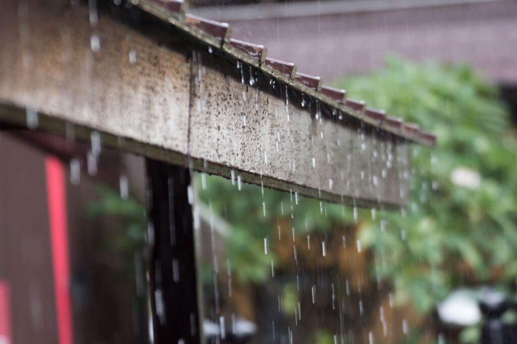 heavy rain on wooden roof, rainy season.
