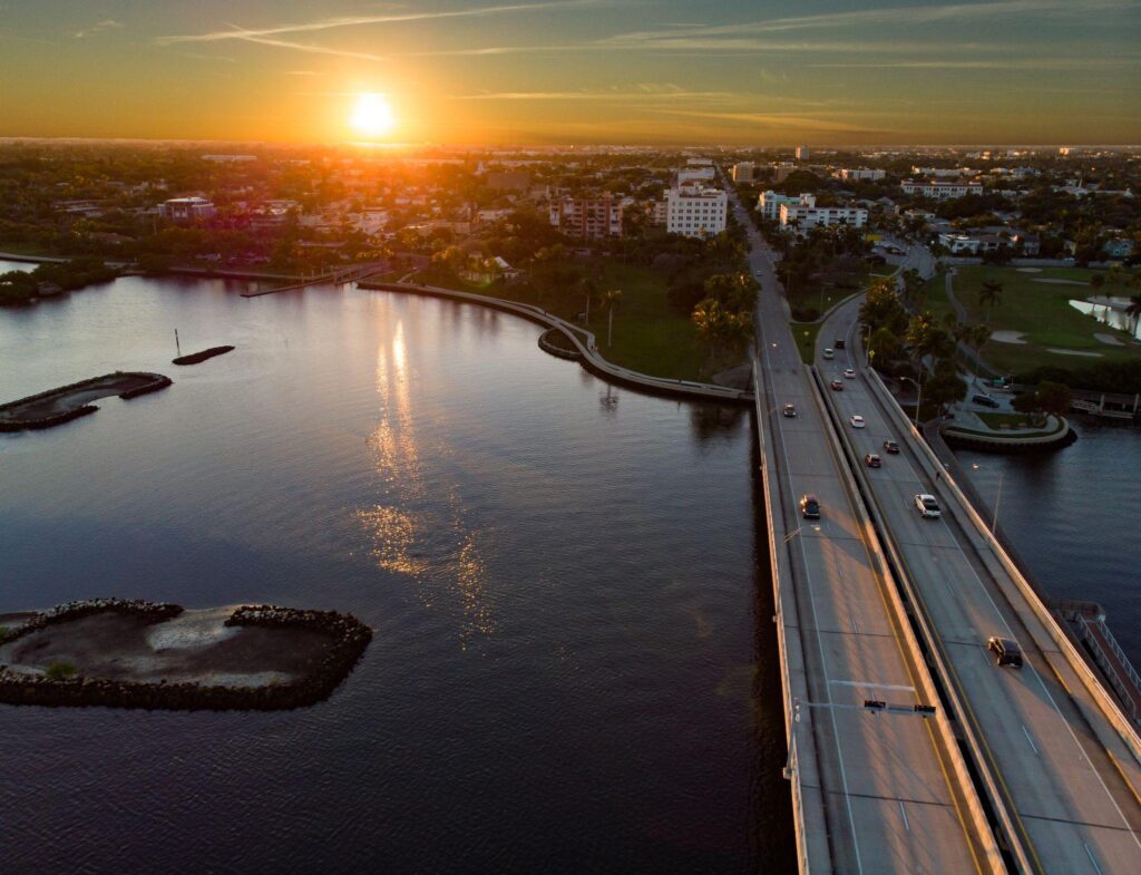 A view of the sun setting over a river.