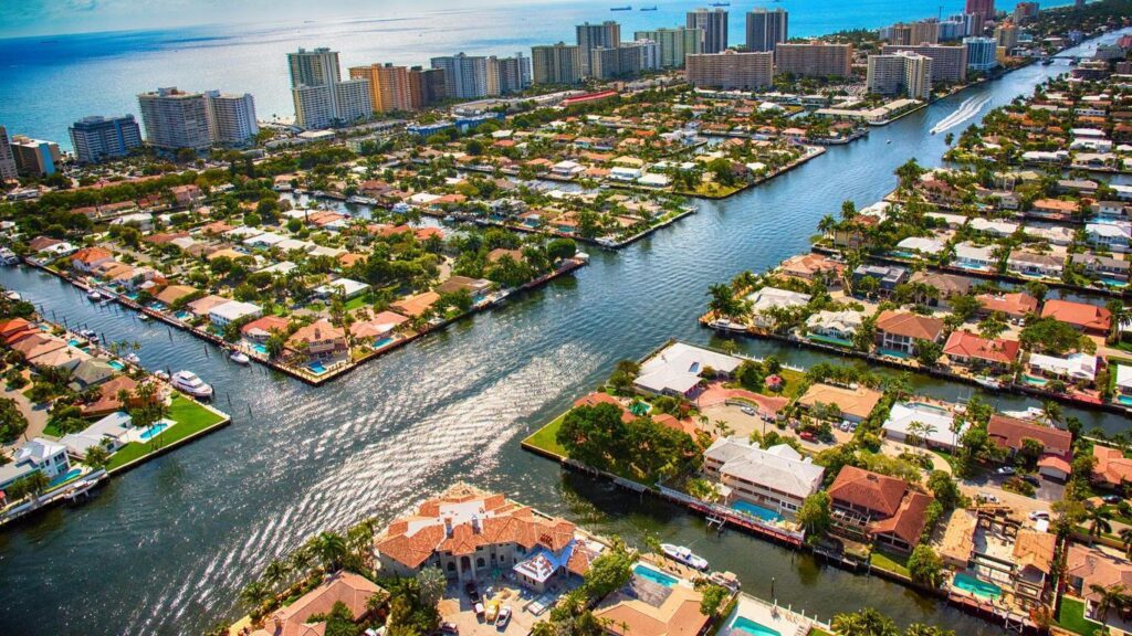 A view of houses and water from above.