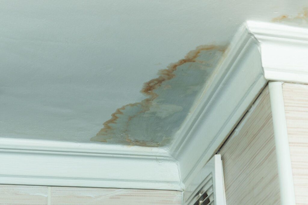 Water-damaged ceiling, close-up of a stain on the ceiling
