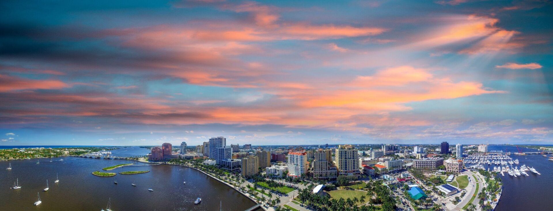 A view of the city from above at sunset.